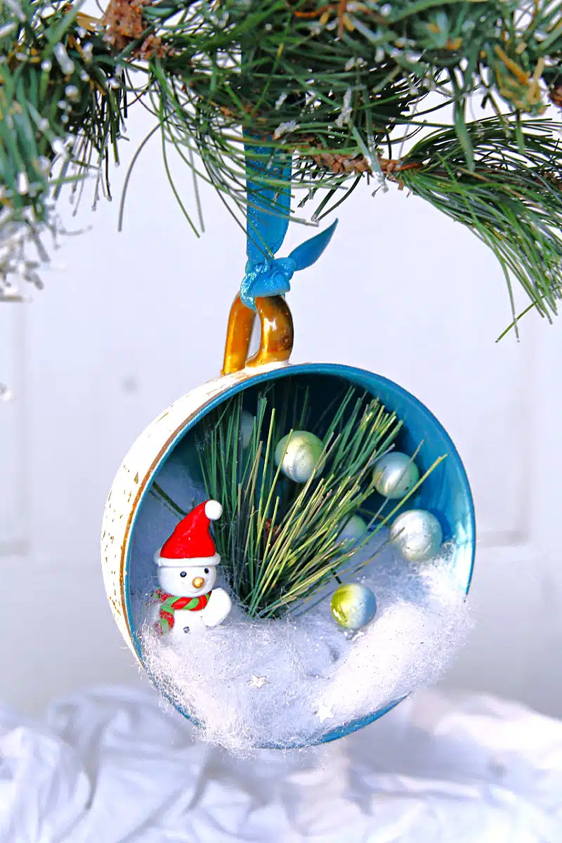 fill a teacup with Christmas items and made a tree ornament