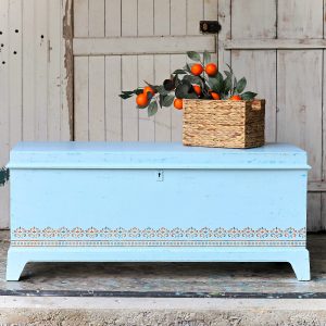 How to paint a cedar chest and stencil a Handmade Charlotte Stencil Design in blue and turquoise.