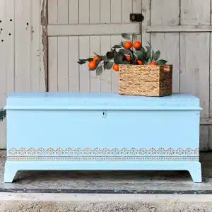 How to paint a cedar chest and stencil a Handmade Charlotte Stencil Design in blue and turquoise.