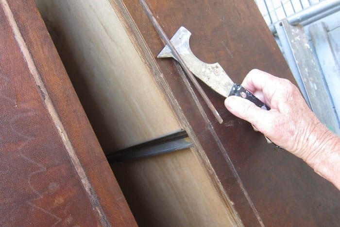 removing detailed wood trim from old furniture