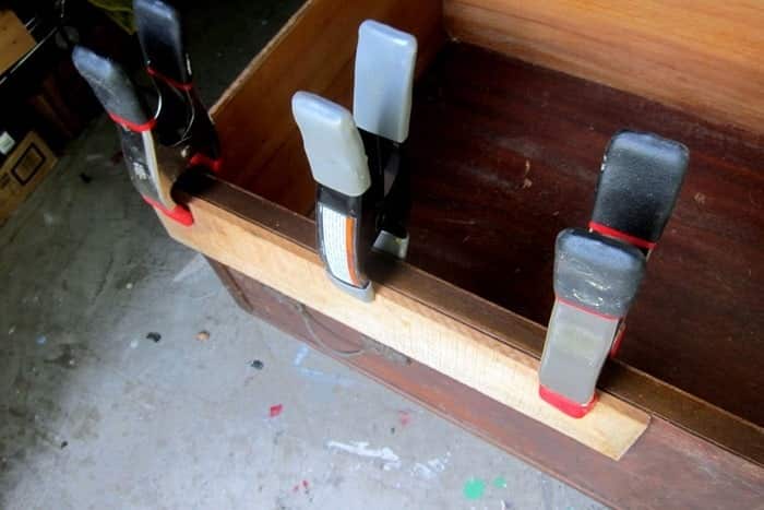 reparing loose veneer on a furniture drawer