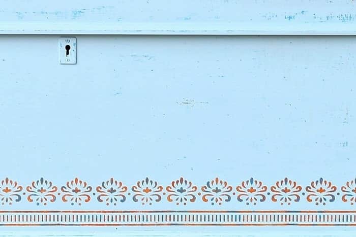 stenciled furniture in colors blue and orange