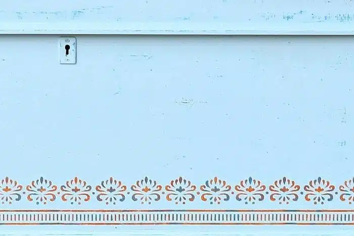 stenciled furniture in colors blue and orange