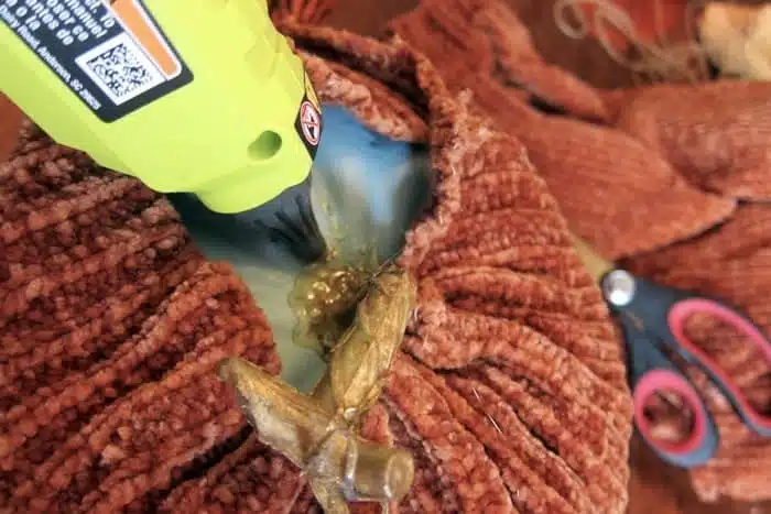 use a hot glue gun to glue sweater to pumpkins (2)