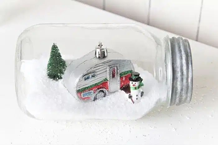 Snow Scene Displays In Glass Containers And Silver Plate Trays