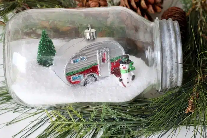 Winter scene in a large ball jar