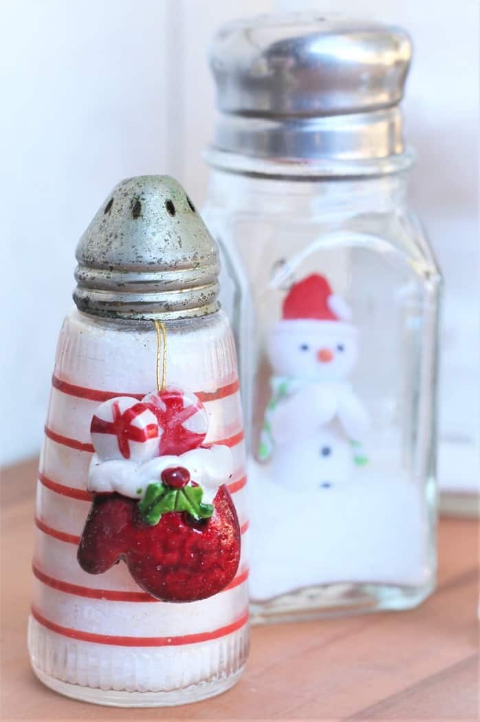 mini snowman in a salt shaker snow scene