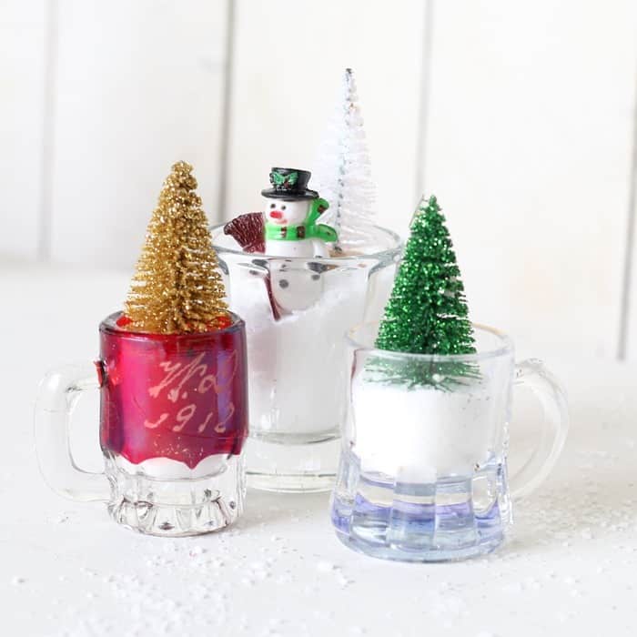 shot glass holding a minature Christmas tree