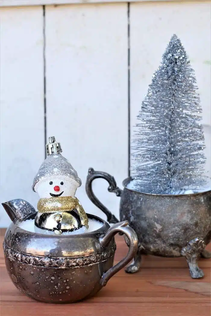 silver plate bowls with fake snow and Christmas trees