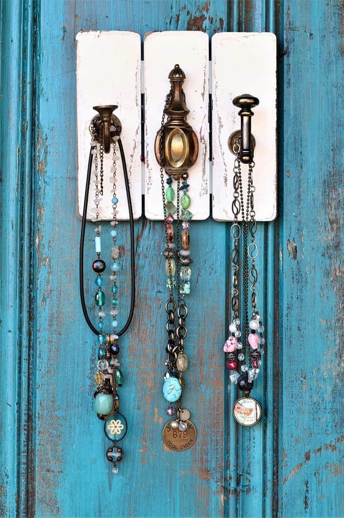 recycled project idea for hanging necklaces on the wall