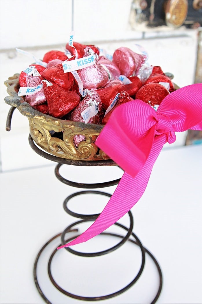 upcycled brass lamp part into a candy dish