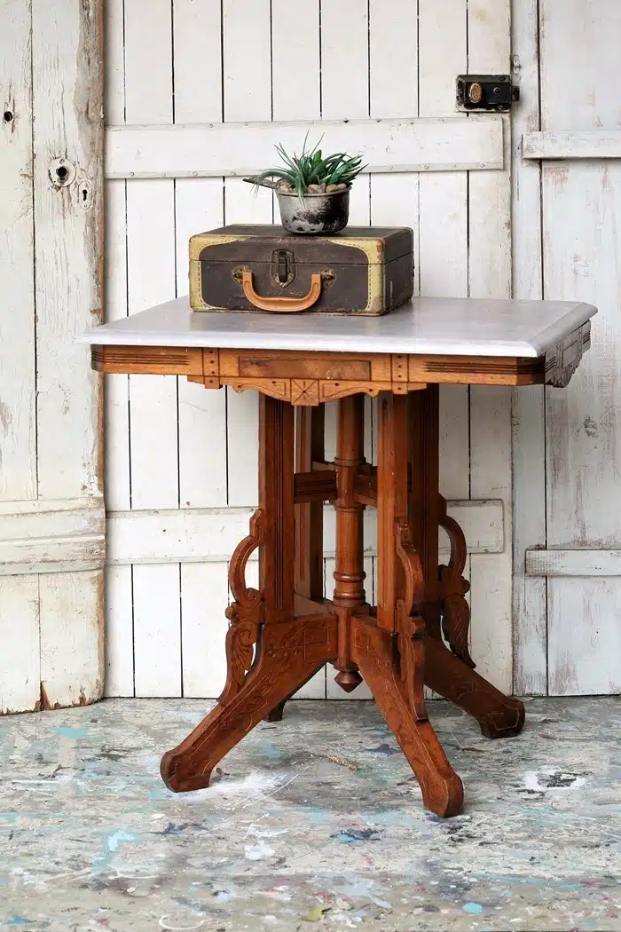Revitalized antique table with upcycled table base and painted tabletop