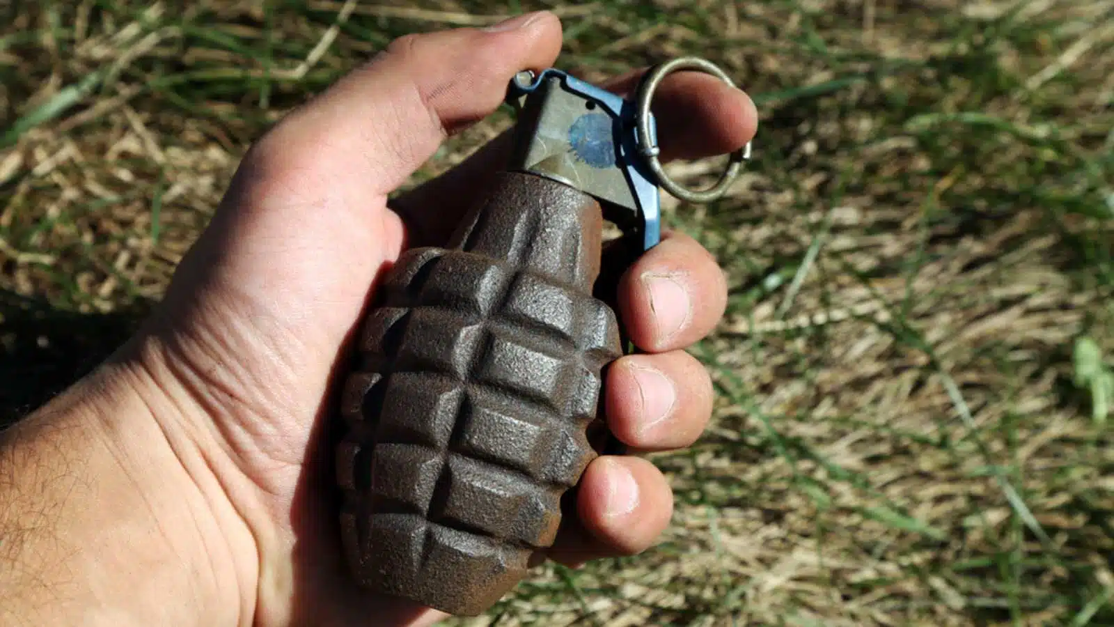 American combat grenade in a man's hand