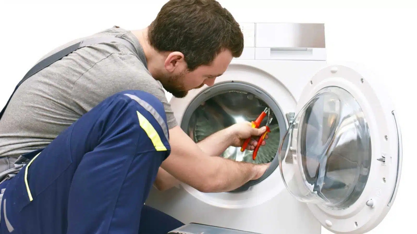 repair washing machine by a service technician at customer's home - insulated on white background