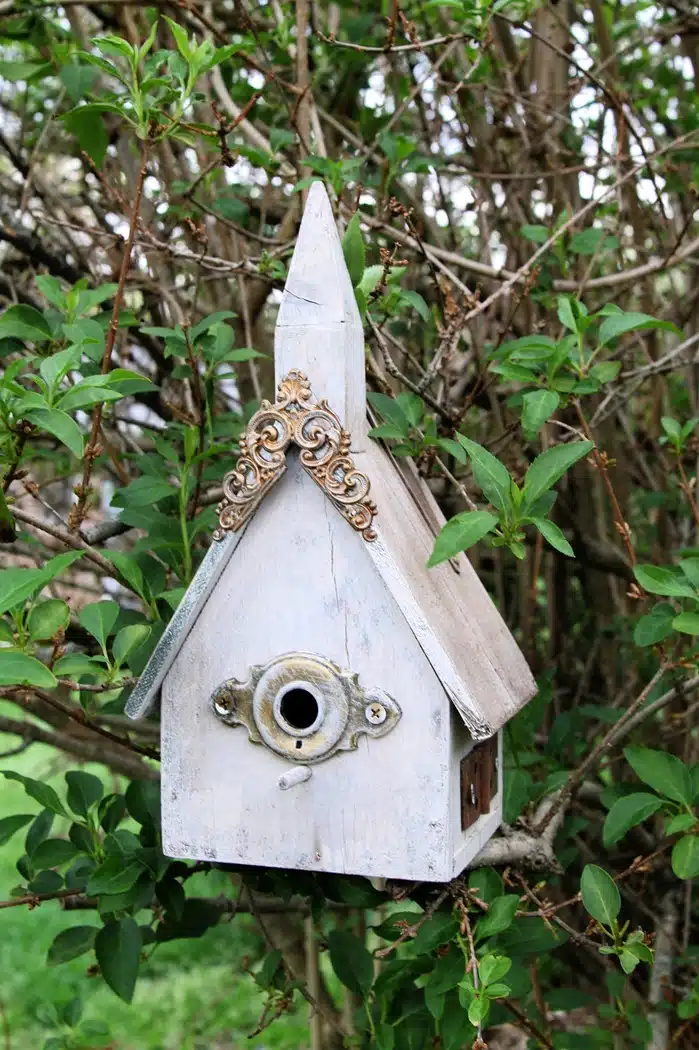 Trash to treasure shabby chic birdhouse decorated with old hardware