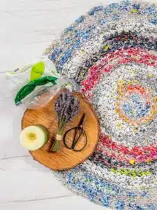 Homemade waterproof crochet rug made from used plastic bags, rag rug. Upcycling and recycling concept. Made of plastic yarn or plarn.