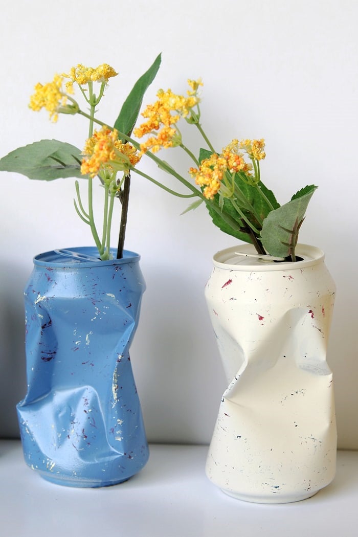 spray paint soda cans and use them as vases