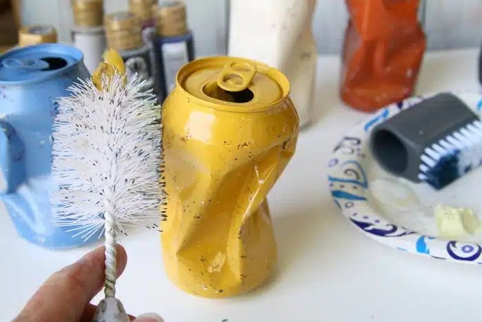 use a baby bottle brush to make dots or speckles on painted cans or other painted surfaces