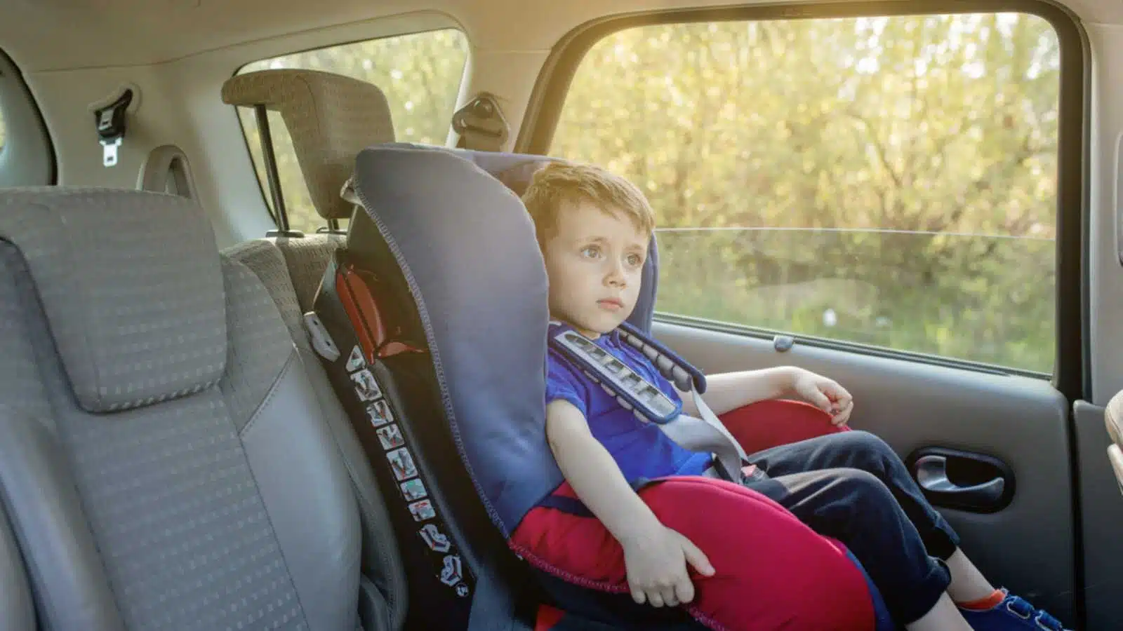 Child sitting in car seat.