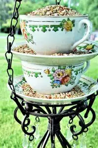Chic DIY Bird Feeder made with tea cups and an iron candle holder
