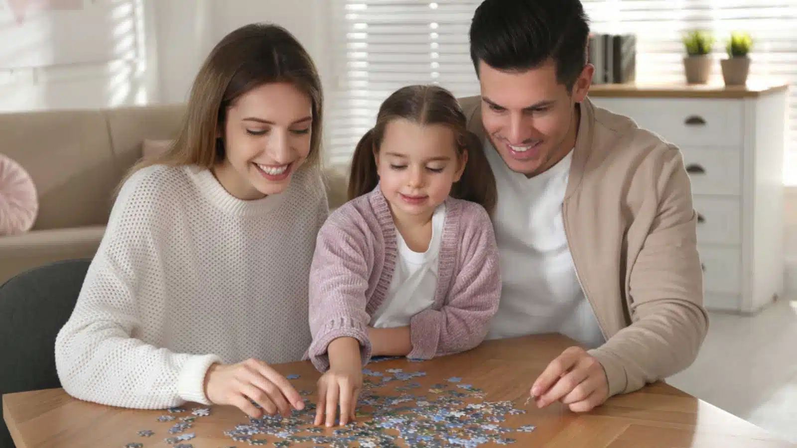 Family playing Jigsaw Puzzle.