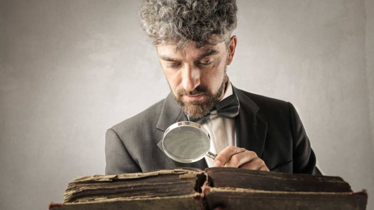 Man reading an old book