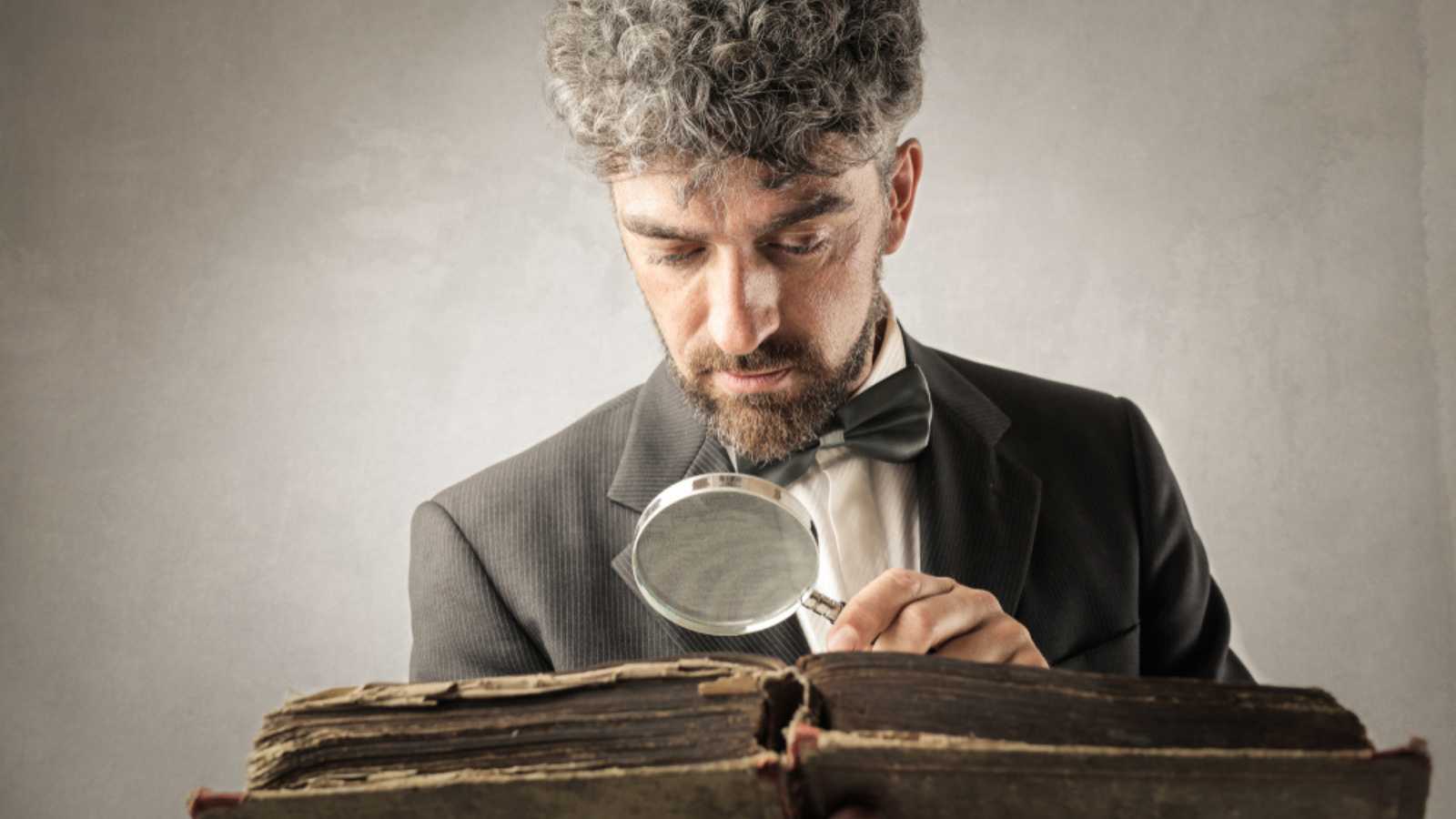 Man reading an old book