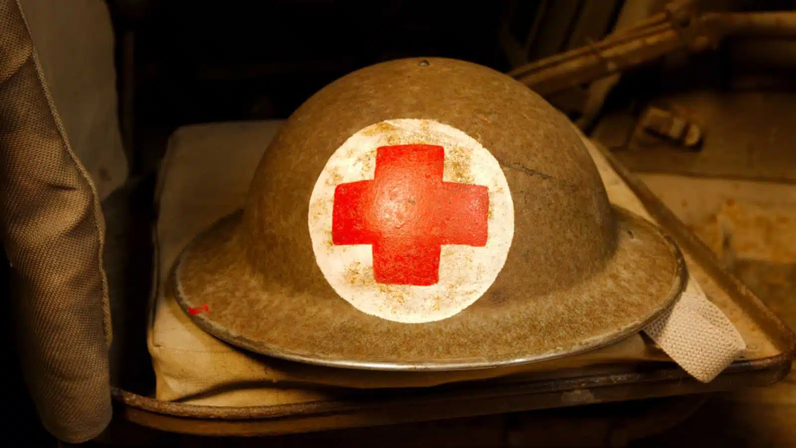 Cobbaton, Devon, UK - 20th April 2019: A World War 2 British soldiers helmet with a red cross on a white background painted on it