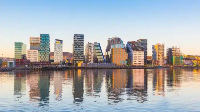 Modern buildings in Oslo, Norway, with their reflection into the water. These are some of the new buildings in the neighbourhood of Bjorvika. Concepts of travel and architecture.