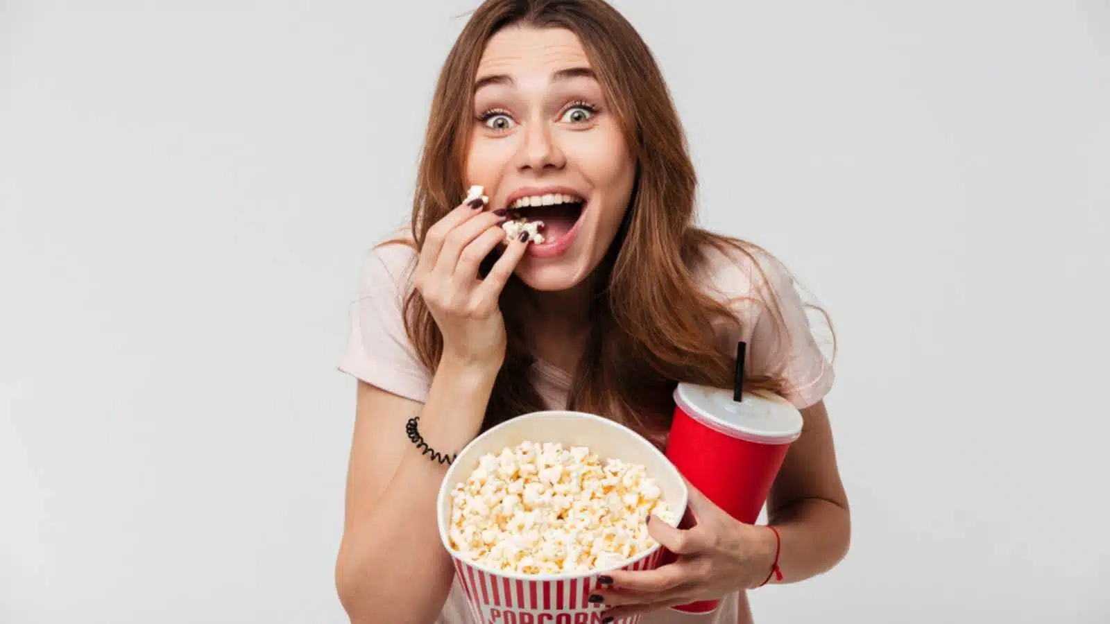 Woman eating Popcorn