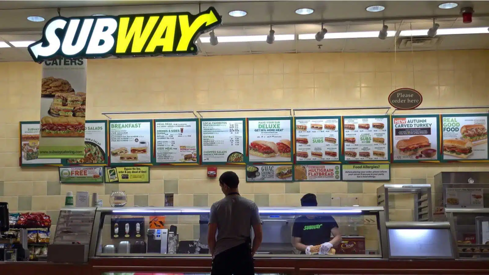 Subway sandwiches menu counter, made to order customer, shopping mall food court, Saugus, Massachusetts USA - November 9, 2016