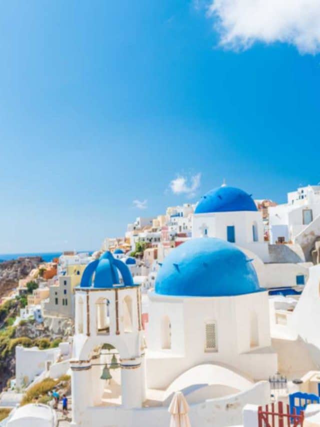 Europe cruise travel summer vacation luxury tourist destination Asian woman relaxing in Oia, Santorini, Greece. Popular european sightseeing landmark. Banner panorama.
