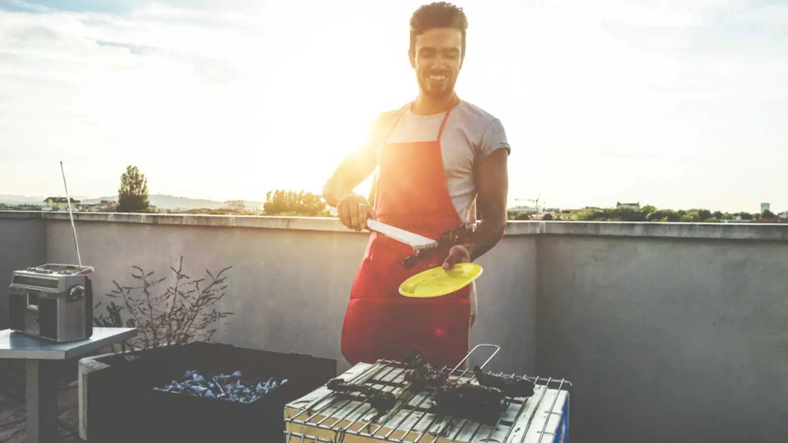 Man preparing food in outdoor grill