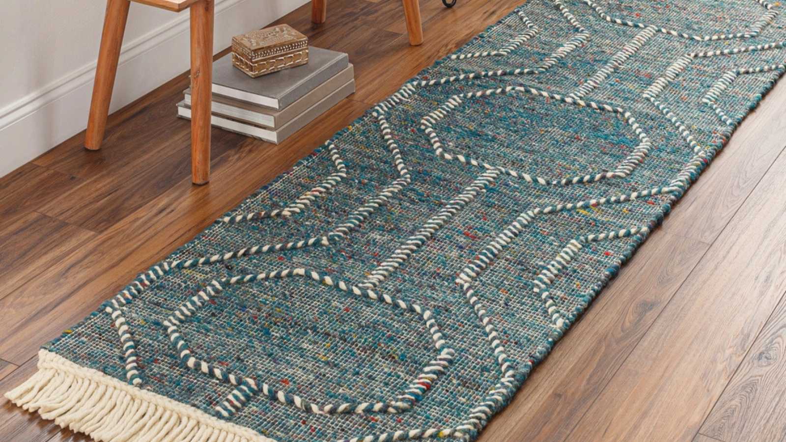 Hand woven trellis wool area rug.