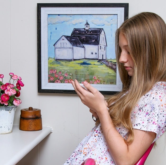 Sofi sitting in our painted bar stools