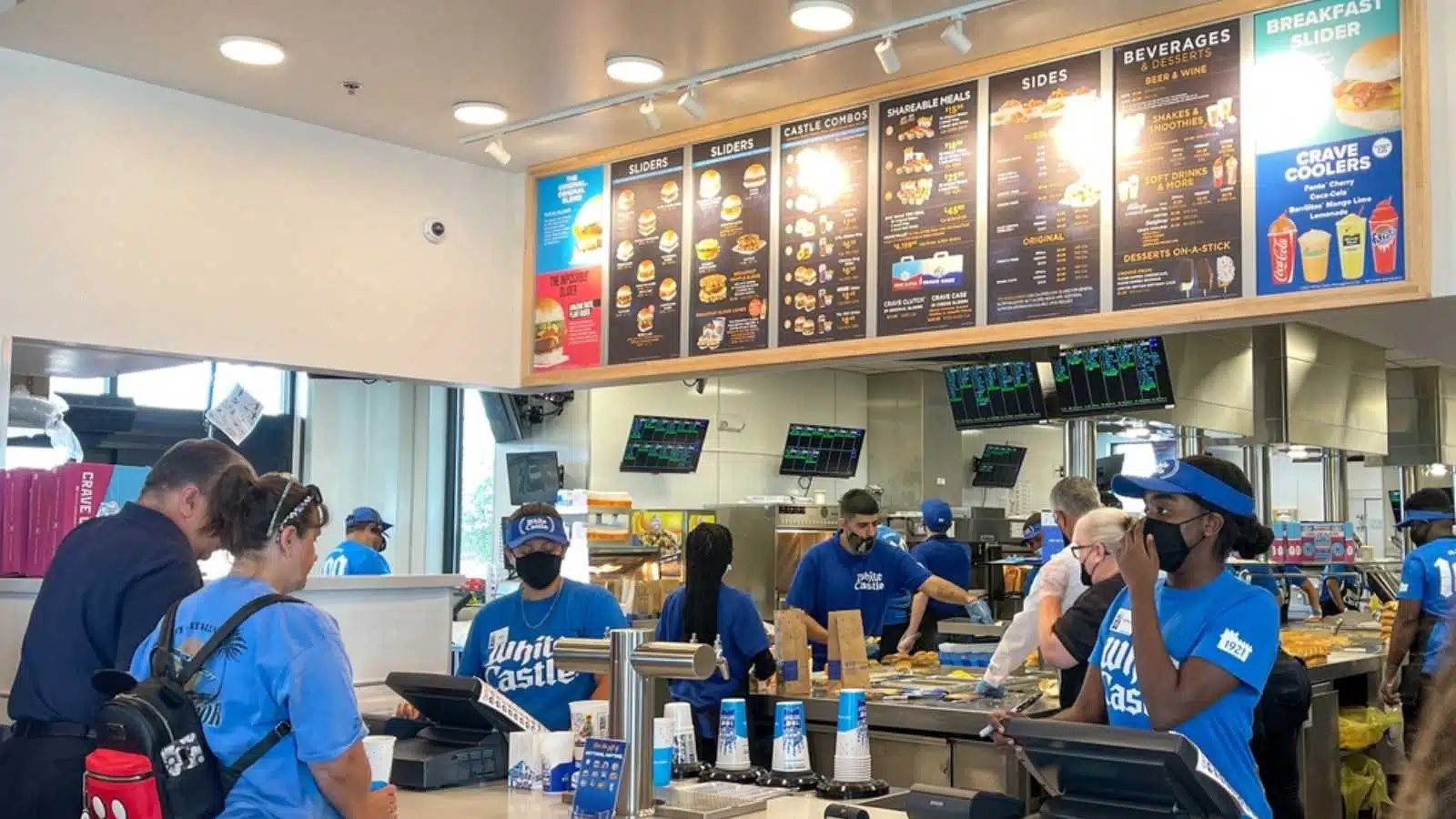 Orlando, FL USA - June 8, 2021: The interior of a White Castle fast food restaurant with employees serving food in Orlando, Florida.