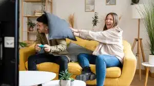 adults with throw pillows