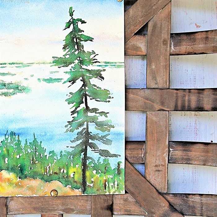 pretty oil painting hanging in a tobacco basket