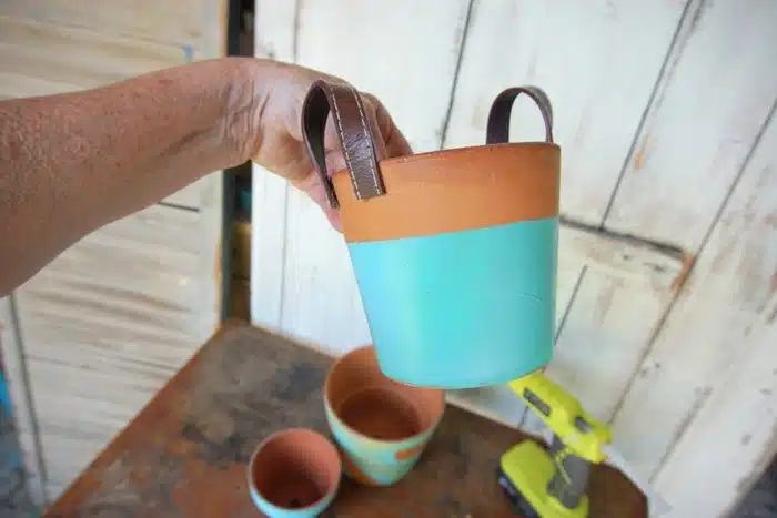 clay flower pot with recycled belt handles
