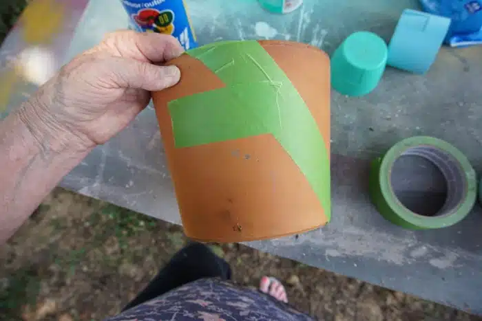 paint a large flower pot using spray paint
