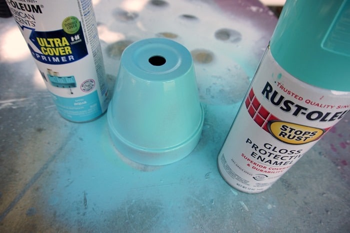 spray paint terracotta flower pots with two colors