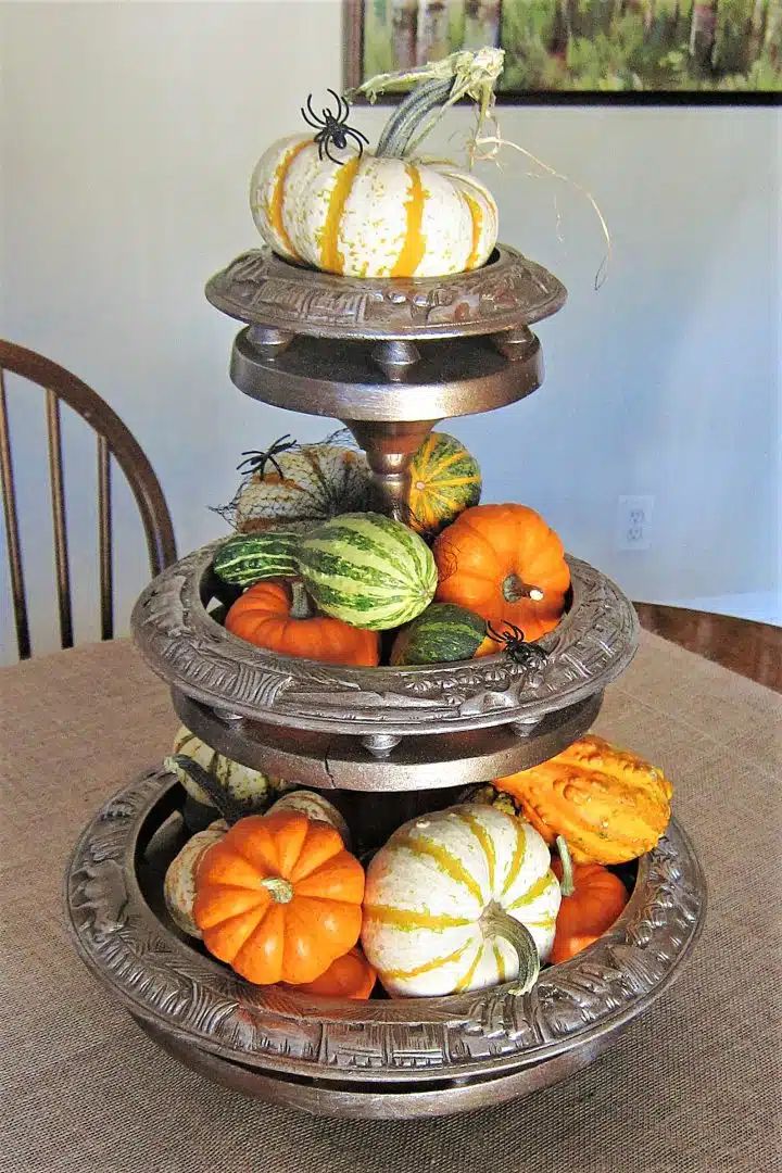 monkey pod tiered tray spray painted with metallic paint and filled with pumpkins