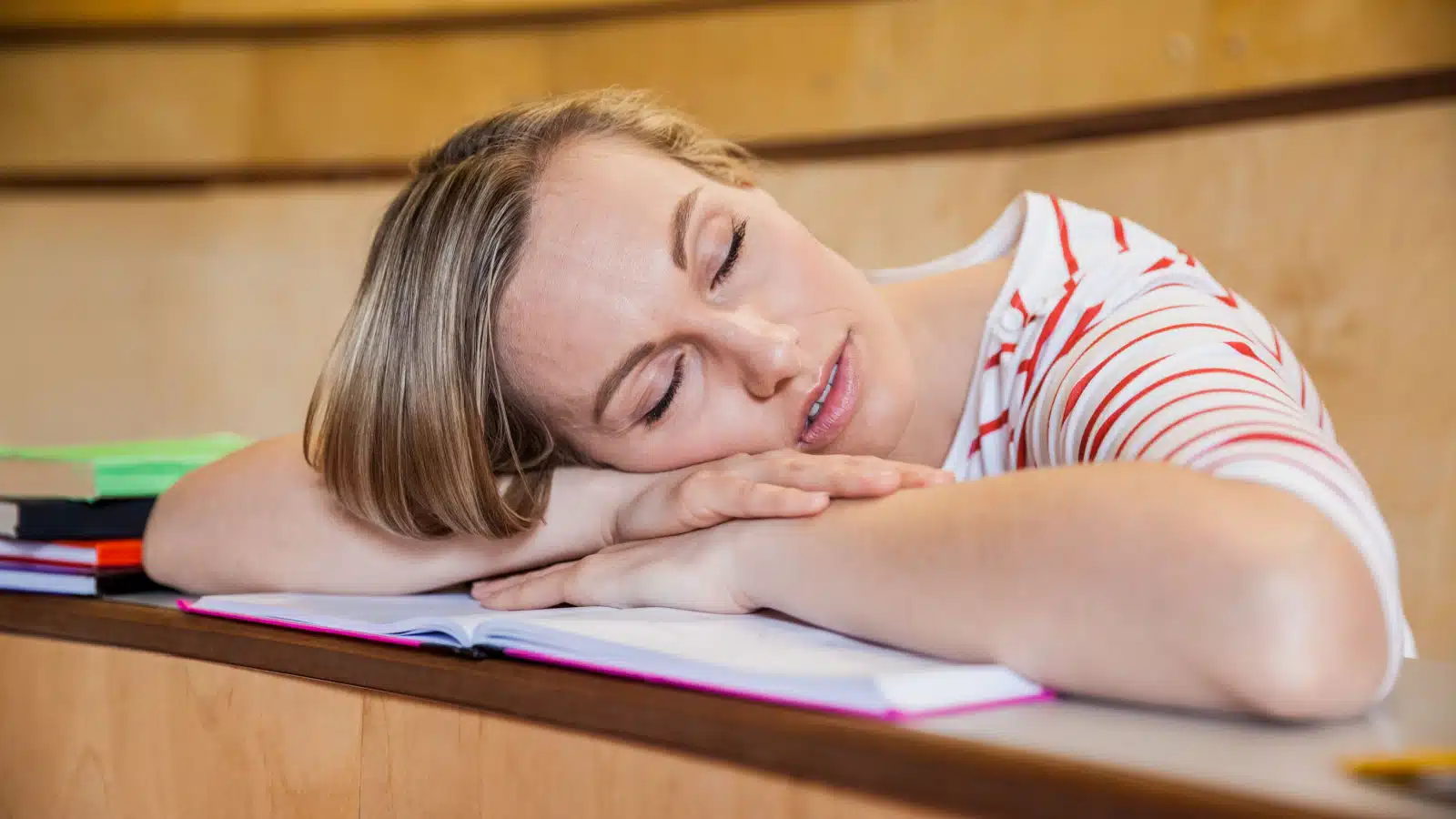 student sleeping at desk