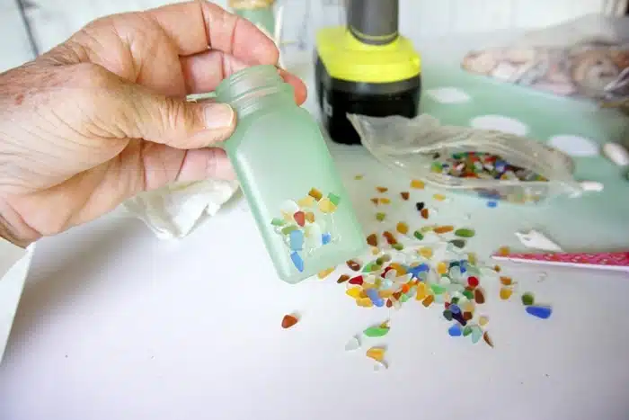 use hot glue to adhere sea glass to salt and pepper shakers