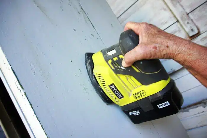 how to distress paint using a sander