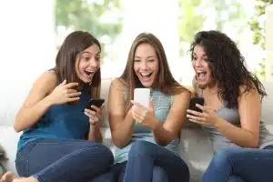 women looking at cell phone