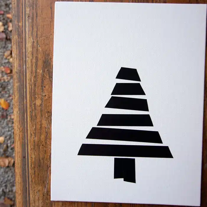 making Christmas tree wall decor using black electrical tape (8)