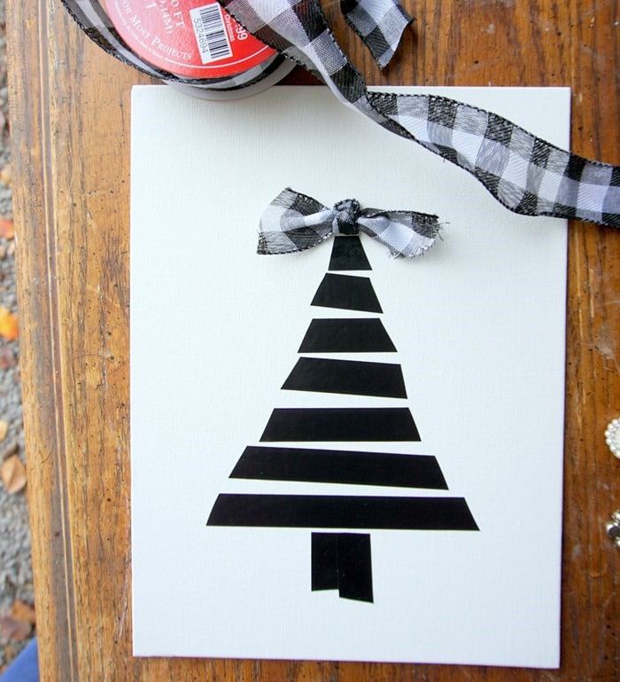 supples and process for making Christmas tree wall decor using black electrical tape (9)