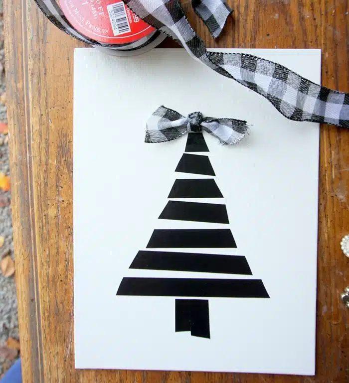 supples and process for making Christmas tree wall decor using black electrical tape (9)