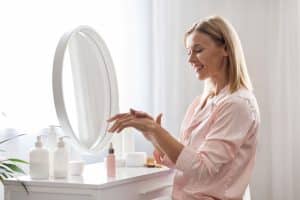 woman sitting at dressing table